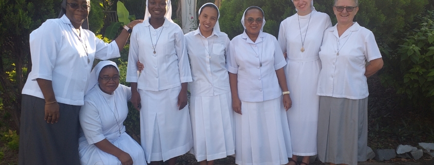 Members of the region together outdoors
